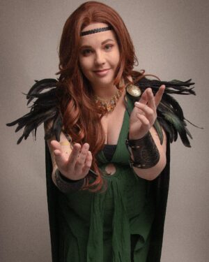 Lindsay Jones Instagram - The photos are in from my second maternity shoot and THEY’RE AWESOME! I wanted to pay homage to Freyja (Freya), Norse goddess of love, fertility, war and death, who is also a mother of two with Odr! Her colors are gold and green, which I implemented into the costume and body paint. Complete with her Brisingamen, feathered cape, sword and shield, she is ready to slay her enemies and her lovers. 
HUGE thank yous to @jonrisinger @texasdelarosa and @andy_blanchard for making this dream of mine a reality! Jon had the brilliant idea to use filters to give them a painted parchment feel. Instagram doesn’t even do these justice. I will be posting more! ❤️