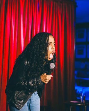 London Hughes Instagram - Been a stand-up for 15 years. Still haven’t mastered how to look cute and tell jokes at the same time. 😩

📸. @calliebphoto