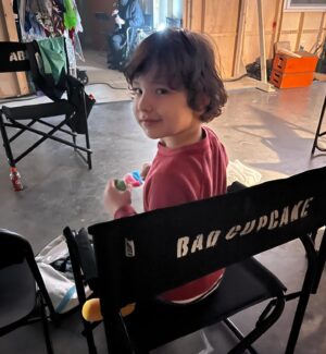 Lucas Grant Instagram - I’m not too sure about this place…these guys seem kinda sus…😅

It was so cool filming at Freddy’s, even though my scenes there didn’t make it into the film. What do you think happened to Garrett after he was taken? I can’t confirm anything but it’s fun to hear theories! 

*Edited to add that “Bad Cupcake” on the back of the chair was the code name of the film, not my character.

#fivenightsatfreddys #fnafmovie #fnaf #fnafgarrett #garrettschmidt