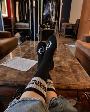 Lzzy Hale Instagram - A personal favorite merch item that I’ve been wanting to do for ages….is now a reality. HALESTORM SOCKS! So soft and comfy, perfect for my rock boots! Available now! #socklife #bunksock #wikifeet #docsocks #rocksocks #halestormmerch