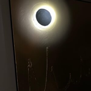Marco Dapper Instagram - Fools Gold. This piece is a fun one with all different types of lighting. (I prefer it in natural lighting) First painting I have done involving light. The ⚫️ represents the sun and the moon. By day the sun, but in darkness with a beam of light directed at the ⚫️ it becomes a lunar eclipse. The black paint doesn’t reflect the light so the illusion of light feels like it’s coming from behind the ⚫️ 60”x48” oil, acrylic, and acrylic spray on canvas. Hit me up if you’re at all interested. Cheers. #lunareclipse #blackholesun