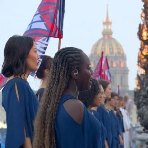 Maria Grazia Chiuri Instagram - Proud to have created a custom Haute Couture @dior gown for the mezzo-soprano @saintcirelaxelle who sang the French national anthem, the Marseillaise, for the opening ceremony of the Olympic Games held in Paris last night. 
We revisited the French flag to create a peplum flag dress in one single piece. 
The choir also wore some special peplums echoing the colours of the french flag as well as holding flags with @faithringgold motto Woman/Freedom.