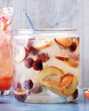 Martha Stewart Instagram - Versatile stone fruits like peaches, nectarines, plums, and cherries soak in white wine to make this sweet yet refreshing sangria. It's a big-batch recipe that will quickly become your go-to drink for summer gatherings. Learn how to make stone fruit sangria at the link in our bio.