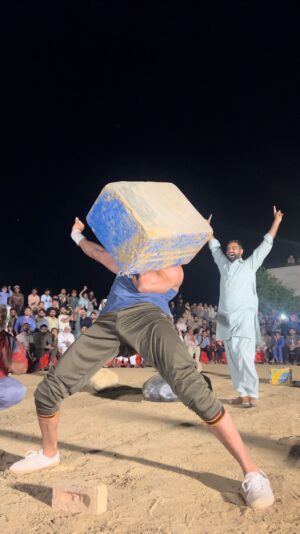 Martins Licis Instagram - What a vibrant and eye opening festival this was! Here, the first athlete, Junaid, performs a unique stone lifting style called “Bugdar,” swinging a 153kg (336lb) stone to his shoulder with both hands. The second athlete, Umair Hassan, impressively hoists a 200kg (440lb) stone to his shoulder, despite weighing only 80 kg. Pakistan boasts incredible strength. PAKISTAN!