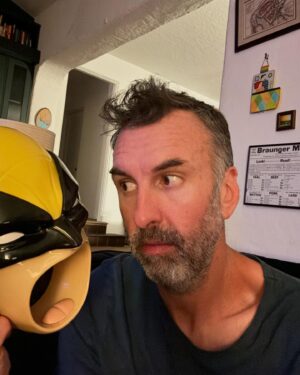 Matt Braunger Instagram - “Dada, why do we eat popcorn out of his mouth?” 😣 @vancityreynolds has kids too and should be ashamed 😆 This thing is part of the household now 🤷🏻‍♂️ Does Rose want to hear about my original copy of X-Men #141? She does not 😂 #deadpool #wolverine #popcorn #dad  #mattbraunger