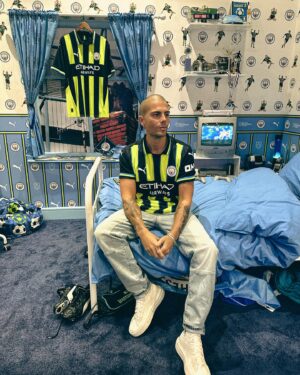Max George Instagram - Back to ‘99… Absolutely love the new spin on such an iconic shirt. Big thanks to @deantymon_ for recreating my bedroom from when I was 10!👏🏻🩵