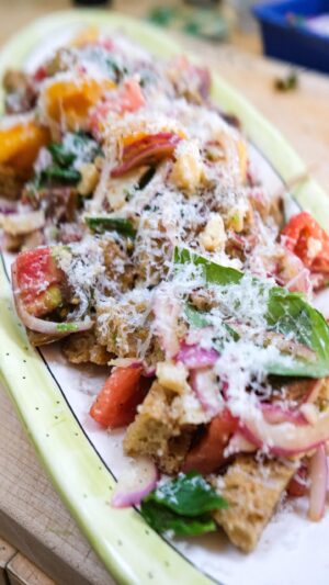 Michael Symon Instagram - Tomato bread salad presented to you by summer garden goodness… this is a really beautiful summer salad.. don’t get caught up in the recipe on this one, use whatever you have on hand or in your garden, cucumbers, peppers and other veg would be great in here…..and DON’T FORGET adding the pieces of parm! It’s a game changer.

More summer recipes on #SymonDinners this week! Catch a new episode with me Lizzy and Liv this Saturday at 12|11c on @foodnetwork