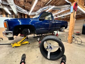 Mike Finnegan Instagram - Trying to stuff 275/35R20 @mickeythompsontires Street Comp rubber bands under the front of my 1998 GMC Sierra. Looks like they will go with some minor surgery.  Big enough to show off the @tbmbrakes but with enough sidewall that I won’t have to get my swerve on when I spy ATL potholes.
