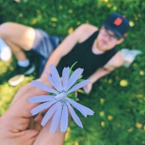 Mitchell Moffit Instagram - Happy bday to my little 🌸 @whalewatchmeplz I realize this photo is primarily of a flower and you're almost completely out of focus, but it was pretty and your bday was a good excuse to post it 🤷‍♂️ jk Love you forever ❤️😘💕 xoxo