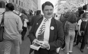 Murray Hill Instagram - Thank you @nytimes @tmagazine for including me in the Culture Issue. Holy sh*t this pix is from 1996 when I ran for Mayor of NY! From the vaults! I've never even seen it! I may be in my 20s here...it's a bit blurry! I do remember getting that tie at a dollar store though! Showbiz!
🤵🏻‍♂️
Treat Procrastination as Productivity

There were certain things I couldn’t do during the [SAG-AFTRA] strike, but I did get a book deal. It’s called “Showbiz! My Unexpected Life as a Middle-Aged Man,” and I’ve got to get that done — by June 1st! I’m used to being onstage. When I’m sitting at my desk in my studio apartment, I procrastinate quite a bit, and I’m always asking myself, “Is this part of the creative process for me, or am I just making my life harder?” But I also procrastinate in productive ways. I go for a walk — in rehab, they taught us, “Move a muscle, change a thought.” Then I come back and put on jazz music. Doing that removes the blocks, probably because jazz is so much about improvisation and I’m at my core an improviser. Another thing I’ll do to light the match is turn to others’ work. I’ll watch Dean Martin videos or a documentary or old game shows. For this memoir, I’ve been reading memoirs by other people — Gary Gulman, Viola Davis, Maria Bamford, Leslie Jones, Aparna Nancherla — and not only does that awaken my creative senses, it triggers memories. — Murray Hill, 52, comedian, actor and writer