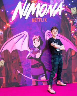 ND Stevenson Instagram - ANNECY JE T’AIME

Never could have imagined that this seven-year journey (or eleven-year journey, depending on how you want to count it) would lead to a standing ovation at Annecy and an honest-to-god medieval castle decked out in Nimona pink. Thank you Nick, Troy, Karen, Julie, and all the other TOTALLY METAL people who fought for this movie to exist. June 30…let’s break some stuff 🤘🦈💥💥💥