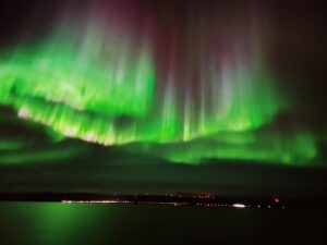 Natalia Cordova-Buckley Instagram - Under star flowers🌟🪷🌟

Floating on an autumn night over the sea just north of the Arctic Circle. 
The only noise comes from the gentle wind hitting the life rafts above our heads. 
In front of us, the miniature lights of a town called Honningsvåg. 
The vast ocean surrounds us, stretching away into the distance until it encounters the horizon. 
A barrier of darkness…the black sky polka doted by the stars.
Out of nowhere, without trumpets or sounds to announce its arrival, the bud of a giant flower. 
Slowly, color and light begin to manifest. 
A cosmic tulip blooming. 
A lotus flower blossoms. 
My mind knows that we are witnessing the Northern Lights but all I see is magic. 

The Cree Indians held that the Aurora was part of life’s circle and were the spirits of the dead who remained in the sky above their loved ones. The Cree believed that the lights were spirits of these departed friends and relatives trying to communicate with those they had left behind on earth.

Noche de Octubre 2-3.
Celebrando un año exacto de tu nueva vida. 
Gracias Primo! 

#auroraborealis
