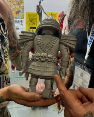 Nathan Blauvelt Instagram - GOD’S HATE & TRANSMISSION TOYS PROUDLY PRESENT THE “WAR MAN” SOFT VINYL COLLECTIBLE FIGURE.

COMING SOON IN GLORIOUS FULL COLOR.

ALL HAIL @mikeybonanno.