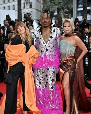 Nicky Doll Instagram - Yes we CANNES ✨

What an absolute pleasure to spend time in Cannes this year. Walking the red carpet with my two absolute icons, with whom we work relentlessly on this little show that does some real good in France and beyond 💅🏼 @daphneburki @kiddysmile we cleared. 

don’t forget to tune in for @dragrace_france season 3 May 31st! 🇫🇷💅🏼

Thank you @france.tv 🫶🏻

Wearing my icon @rochart_design sketched by @farida_kant 
HMU @juliencharlierparis 
Jewelry @gv.jewels_costumes 
Shoes @louboutinworld