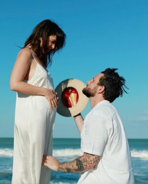 Nico Tortorella Instagram - We’ve got some big news: We’re having another baby!

This era has been all about transition, bending and shifting in order not to break. We left everything familiar to find something new—somewhere the grass really is greener because the sun shines more. We did it. We moved to a place where we can grow food year-round, where we can run barefoot, chase lizards, play in the ocean, and literally stop to smell the flowers. Somewhere we can continue to build our family.

The very day we arrived at our new house, we made a baby. Really, it’s true. It’s funny how, when you commit to dreams and embrace changes, miracles unfold.

Today’s a big day with a lot going on:

- My children’s book ‘Olivette is You’ launches today! @randomhousekids 
- I’m on the wonderful podcast @notskinnybutnotfat which is live right now!
- Also, my album ‘Born.’ drops this Friday, complete with a very special music video all about being pregnant.🔻🔺

Despite all this, seemingly none of that matters. Right now, this moment is a celebration of life at a time when life itself seems the most fragile.

Bethany, thank you for creating the space to continue to grow our family. We are nothing without you. I am constantly in awe of your strength and willingness to expand. And Kilmer Dove, get ready girl—it’s big sister energy from here on out. I love you both. I love all of you. All of it is you.

📷 by @rocco_tortorella
