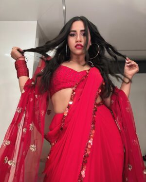 Nikhita Gandhi Instagram - Channeling my inner Bong Bae ♥️ 💋 

Outfit @manishmalhotra05 
Bangles @styledbysujata 
Hair @nikita_makeup_hair 

#desi #saree #red #redsaree #manishmalhotra