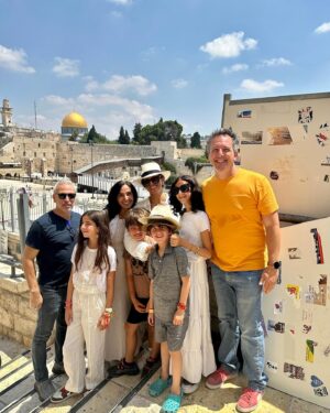 Noa Tishby Instagram - There’s no place like #jerusalem. Every time I’m in Israel we spend a few days in this magical city with friends and family. And today it’s more important than ever... 

As soon as we got to the hotel I heard an incredible group of reservists wives is there for a conference @mamatcal1 so I had to pop in, spend some time together and see how these brave lionesses are holding us all up. (And hold a cute baby too :) 

We went to the rooftop of @mamillahotel for sunset drinks and from there to the Food Truck Festival @autochel_je and a laser show over the old city. Next day we spent time at the new and renovated National Library @nli_israel with ancient and modern Jewish literature. Next we went to the Hebrew music museum @hebrew_music_museum where the kids (ok, the adults too) got to play old and new instruments. Shabbat dinner was stunning at Chakra restaurant. @chakrarest Beyond delicious fusion Israeli food. The next day we walked the old city again and got to climb all the way to the top of the ancient minaret at @towerofdavid! It held up well. Thank G :) 

And yeah, Ari chose that shirt on his own 😂 

Can’t wait to be back, I💙JLM 

Thank you for everything as always @itraveljerusalem @reutf81 @asia.spectour 
 
אין על ירושלים…. בכל פעם שאני פה אני מקפידה לעשות טיול בעיר המהממת שלנו - והיום זה אפילו יותר חשוב מתמיד. כשהגענו אמרו לי שיש במלון קבוצה של נשות מילואים בחופשה עם ארגון נפלא שנקרא ממטכ״ל אז הלכתי לפגוש אותן ולעזור להחזיק תינוק, כי זה מה שצריך לעשות לאשת מילואימניק שסוחבת הכל על גבה לבדה. הן היו מדהימות אריות (לא לביאות! אריות!!) מעוררות השראה. 

בילינו שלושה ימי קסם בעיר הקסומה הזאת. מלון ממילא היה מהמם עם שקיעה מדהימה כתמיד. אוטואוכל זה גאוני והילדים אכלו רקדו רצו להם והשתוללו עד מופע הלייזרים מעל העיר העתיקה. למחרת נסענו לספרייה הלאומית והיה פשוט עוצר נשימה חובה להגיע גם הילדים נהנו. מוזיאון המוזיקה היה מקסים. בערב הלכנו למסעדת צ׳אקרה וטרפנו אוכל מושלם. למחרת טיילנו שוב בעיר העתיקה קניתי זעתר ותבלין שווארמה והסכמתי שארי יקנה את החולצה האדומה הזאת כי… כי זה לא לא נכון 😂 אני אוהבת את ירושלים כל כך… לא יכולה לחכות לחזור שוב. 💙💙💙💙💙.