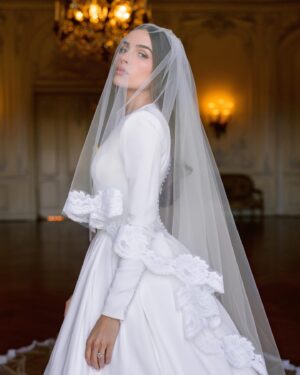 Olivia Culpo Instagram - @oliviaculpo and @christianmccaffrey are married! The model and former Miss Universe walked down the church aisle in Watch Hill, Rhode Island in a long-sleeve crepe crew neck ball gown with a voluminous skirt and button-lined back. “I wanted it to feel timeless, effortless, and as if it’s complimenting me, not overpowering me,” Culpo exclusively shares with Vogue. At the link in bio, watch her final fitting at @dolcegabbana and see the details behind her stunning gown. Photos: @josevilla