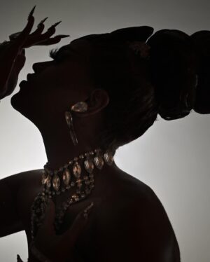 Olivia Lux Instagram - if it’s one thing about me- I will still serve face even in silhouette 😂 

this is one of my favorite pieces; I finally did a photoshoot in her. My inspiration for the design stemmed from goddesses and royalty. I wanted a piece that embodied a regal “light” goddess 🤍✨🌟 LUX … the garment was a labor of love and all the collaborators and designers I worked with are incredible !! check them out and show them some love !! 🤍⤵️

photo: @jonas.fashionfiles @juanjojonasfotografia 
fit: @abrahamdlevy @blackandwhitestriped 
hair: @draglabwigs
jewels: @draggedoutlondon