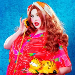Parker Day Instagram - True story: These Garfones, beaten by the sea across time, have been washing up onto French beaches since the 80s🙀 there was a big cargo shipwreck that scattered the feline phones.

Model: Natalia @nainati 
Mood: Sexy
Sign: Gemini 
Prop: Garfone
Background: Sky

Assistant: @ariasburdelli
