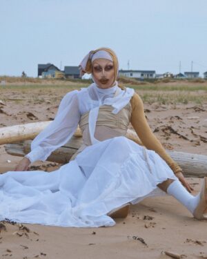 Pythia Instagram - We live in between the salty sea and sky above. We live between a rising high and angry God. 🌊

I went to PEI this past weekend for a show and the people, the hospitality and scenery was so inspiring to me so I went to a thrift store, bought a whole bunch of garments and curtains and patched them together in my hotel room and shot these @alliex inspired photos super last minute just cause the energy was so good! 🤍 Hope to be back soon! 🥲💕