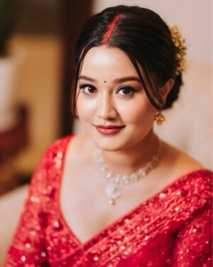 Riyasha Dahal Instagram - Red like a blushing rose. 
.
.
.
Wearing: @samrat_couture 
MUA: @swechchhya.makeup 
Hairstylist: @glamby_pratikshya 
Assist by: @rajshbibhari_ 
Jewelry: @shree_natraj_jewellers 
Lens: @visions.np