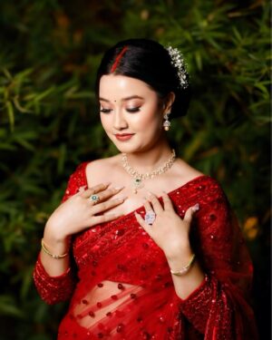 Riyasha Dahal Instagram - Red like a blushing rose. 
.
.
.
Wearing: @samrat_couture 
MUA: @swechchhya.makeup 
Hairstylist: @glamby_pratikshya 
Assist by: @rajshbibhari_ 
Jewelry: @shree_natraj_jewellers 
Lens: @visions.np