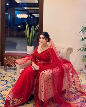Riyasha Dahal Instagram - Red like a blushing rose. 
.
.
.
Wearing: @samrat_couture 
MUA: @swechchhya.makeup 
Hairstylist: @glamby_pratikshya 
Assist by: @rajshbibhari_ 
Jewelry: @shree_natraj_jewellers 
Lens: @visions.np
