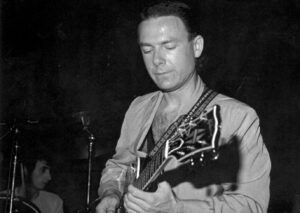 Robert Fripp Instagram - On this day 44 years ago, RF was onstage with the League of Gentlemen at Decade in Pittsburgh. Excerpts & download via link in stories (and on the Music page at dgmlive.com)
“I wanna see this shit,” says a punter who was, presumably, on his way past the desk at the back and on his way forward to the front. We’ll never know if once having got there he started hopping and bopping or if he simply stared in direct contravention of Robert’s entreaty prior to the band kicking off with their signature tune, Inductive Resonance. A glance at the Pittsburgh Music History website reveals that “bands gigged in the back room on a wide stage set along the side wall a few inches off the ground. The walls were thick grey stone and the ceiling was low. To soak up the ricocheting sounds parachutes were hung across the ceiling.”It’s a lively crowd at The Decade with the customary whoops and wails. However, in addition, we get the bonus of an outburst of spontaneous punky chanting during Heptaparaparshinokh and Minor Man. Toward the final quarter of the show the tension between the dancers and the stationary punters. “For those who are standing here mobile being stared at, isn’t helpful.” We love you, shouts out one of them. “You may love me, sir but you’re stealing me with your adoration.”

#leagueofgentlemen #robertfripp #barryandrews #saralee #johnnytoobad