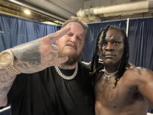 Ron Killings Instagram - Me and @postmalone backstage at #Summerslam2024 discussing a music collab!! Yahh!!🙌🏿🔥