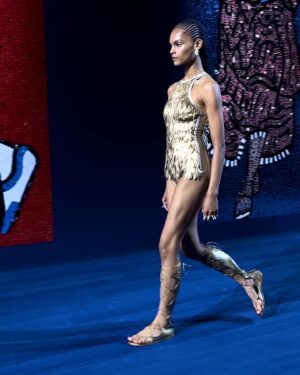 Rosamund Pike Instagram - Exceptionally beautiful time at the Rodin museum watching the @dior Haute Couture show. Mirrored and embroidered wall panels by the late great Faith Ringgold depicted athletes in all disciplines and sports, providing counterpoint to the physiques of models draped and tailored in exquisite pleating, metallic jersey, feathers and ribboned fabric. Movement was an essential part of this show. And I have tried to capture bodies in motion. Architecture of the body celebrated by fine architecture of clothes. Maria Grazia has outdone herself today. A shining show!!! My hair and makeup done by @valeriaferreiramakeup and @davidebarbieri_