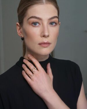 Rosamund Pike Instagram - Exceptionally beautiful time at the Rodin museum watching the @dior Haute Couture show. Mirrored and embroidered wall panels by the late great Faith Ringgold depicted athletes in all disciplines and sports, providing counterpoint to the physiques of models draped and tailored in exquisite pleating, metallic jersey, feathers and ribboned fabric. Movement was an essential part of this show. And I have tried to capture bodies in motion. Architecture of the body celebrated by fine architecture of clothes. Maria Grazia has outdone herself today. A shining show!!! My hair and makeup done by @valeriaferreiramakeup and @davidebarbieri_