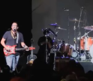 Sal Vulcano Instagram - Eleven years ago, @joe_gatto and I got thrown in front of 14,000 people as one of the opening acts at a sold out @imaginedragons show at Jones Beach Theater in Long Island. We don’t play instruments or sing. 

There were already *two* proper opening acts before us. They did NOT want a third. 

We were introduced as “Senora Lanza” (a nod to our high school Spanish teacher) and told to refer to them only as the ImaginATION Dragons, then read an introduction that dedicated the show to the people of Pittsburgh, a much more worthy audience than the folks of Long Island. Then told to “start playing songs”. 

THEY KEPT US OUT THERE FOR 20 MINUTES as the crowd got more and more upset. At one point Joe was told to do a drum solo while I had to do the worm across the stage. Joe just started slamming on the drums yelling “DRUM SOLOOOOOO!!” while I flopped around on the floor. 

Around this time an angry man charged at us from side stage and tried to grab my guitar from my hands. He began cursing and screaming at me. “Give me the guitar! Get off the stage!” I didn’t know who he was or what he was doing. So I pushed back and kept scrambling to avoid him, yanking back my guitar and dodging around, all while continuing to “play” and “sing”. 

I was then told to stage dive into the crowd. I didn’t want to injure anyone so I proceeded to meekly jump off the stage feet first and we were ushered out as people screamed in our faces as we dodged full cups of soda being thrown. 

I got backstage only to learn that the man trying to take my guitar was the stage manager. Bc I didn’t let him remove me, the concert went past its curfew and into overtime union pay. This is to be avoided at all costs bc the fees then become astronomical. I can’t begin to imagine the extra costs.

I believe the last thing I yelled on the mic was “F the Imagination Dragons”. They were amazing sports about it and just great people for letting us do all of this in the first place. 🙏