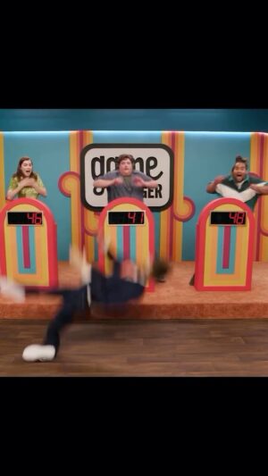 Sam Reich Instagram - presenting a new little social series i call “behind the clip.”

“sam says 3: don’t flinch” was our third time doing a “don’t flinch,” and needed to build on the other two times (my screaming; little me’s popping out of podiums). ⬇️

i had originally wanted a dummy me to fall from the ceiling, but thought that was too ambitious, so instead pitched to ash that me “snakes in a can” should launch at our players from the sidelines. as it turns out, snakes from a can don’t launch very far.

i then pitched ash plan A as plan B, and ash thought it was very achievable. the final rig is merely a cloth bundle and rope, triggered from backstage. it looked lighting-related. ash’s cue was my “moving right along,” which is why i say it so loudly.

in the edit, we collapsed down vic, jacob, and lou’s lines to be rapidfire, when the truth is we spend a full minute recovering from this. it is one of a handful of game changer moments when i’ve wondered if i’ve really gone too far — and one of my favorites in the series.
