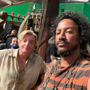 Samba Schutte Instagram - Crew Shoutout part 2: the first time I met @rhysiedarby at rehearsals he said hi and I said “I LOVE YOU”☠️ Never walked it back since. He worked so hard this season but always looked cool, always improvised effortlessly as Stede⚔️ That red suit WAS cursed- triggered the fire alarm as soon as he stepped on stage❤️‍🔥 And that mermaid tail was really heavy, but look how graceful!🏴‍☠️🧜‍♂️ 
#OurFlagMeansDeath #ofmd #ofmdseason2 #bts