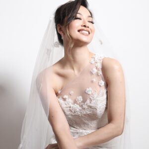 Sarah Lian Instagram - Couldn’t be more in love with this wedding gown by @syomsz @syomirizwagupta. Featuring an asymmetrical neckline with illusion panels and a corseted bodice, this dress had a silk chiffon skirt that was incredibly light, with a sexy high slit for ventilation. 

It had all the details I wanted without looking over the top and yet a traditional white with beautiful floral motif lace overlayed to create depth with textures. With hand sewn appliqués on both my veil and dress (by Martin and Syomzs), this was 100% made with love. 

Most of my meetings with Syomir was 1:1 and there’s no one else I would have wanted to create this special piece that will be etched forever in my memory. Syomir, I love you and I’ve never felt more Yan Sow Lin in my life! Thank you for creating this with me. ❤️❤️❤️

Pino- we finally made it happen!!! Kakak dah kahwin! 

📷: @pinography 

#syomirizwa #weddinggown #thetingtengs #bespokedesign