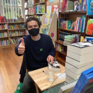 Sebastian de Souza Instagram - Just been inside a bookshop — a REAL ONE! — for the first time in a year! 

I had the most wonderful, soul-enriching time signing books at @westendlanebooks . Get your signed and personally dedicated copy on their website NOW!

In writing and publishing KID: A HISTORY OF THE FUTURE @offlineruniverse and I are DETERMINED to support local bookshops in the UK and all over the world as they emerge from a pandemic that has completely devastated their business. 

So! Go Offline! Get your copy from @westendlanebooks now! They ship internationally!

I love you all so much Souzles ❤️