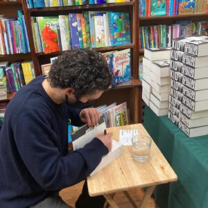 Sebastian de Souza Instagram - Just been inside a bookshop — a REAL ONE! — for the first time in a year! 

I had the most wonderful, soul-enriching time signing books at @westendlanebooks . Get your signed and personally dedicated copy on their website NOW!

In writing and publishing KID: A HISTORY OF THE FUTURE @offlineruniverse and I are DETERMINED to support local bookshops in the UK and all over the world as they emerge from a pandemic that has completely devastated their business. 

So! Go Offline! Get your copy from @westendlanebooks now! They ship internationally!

I love you all so much Souzles ❤️