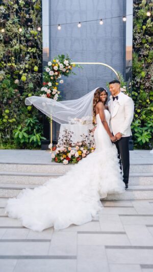 Taja V. Simpson Instagram - A TIME WAS HAD!! I’m so grateful for my village!

Reflecting on our wedding day, I’m overwhelmed with joy and gratitude. Every moment was filled with love, laughter, and the warmth of family and friends. It was truly an amazing day!!

Bride @tajavsimpson 
Groom #RyanEaster
MUA @marquiswardbeauty 
Hair Styling @joyboylace 
Hair unit @modernbeauty_co 
Grooms Hair @itsuniversall 
Assistant @shamyajamerica 
Venue @shadehotelmb 
Flowers @flowersbyladybuggs 
Cake @torrancebakery 
Dress @martinalianabridal c/o @bridalelegancestudio 
Shoes @betseyjohnson 
Photographer @jorgemezaphotos 
Videographer @foreverfr3sh 
DJ @djrtistic 

#wedding #bossip #tajavsimpson #blacklove