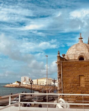Tiya Sircar Instagram - Cádiz is said to be Europe's oldest continuously inhabited city. 3,000 years young! Founded by the Phoenicians, inhabited later by the Romans, then Moors, then Spaniards, it’s a beautiful, ancient, vibrant city full of gorgeous architecture, stunning ocean views, and insanely delicious food (and wine and beer and sherry and…🤌🏽). If you’re anywhere near Andalusia, COME HERE. She’s a beaut! 🇪🇸🦐🍷🌊🦑🌴