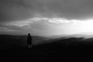 Tom Cullen Instagram - Ali on the mountain. This was taken the morning of our second and final day of shooting the Come on Baby music video.

Day one we filmed all of the interiors and little bits of around the cottage. It had been a very fast and intense day because we had so much to cover. The crew worked tirelessly to complete the day but it was impossible not to want to work hard because Ali had been so extraordinary. In front of us all, she poured her soul out. Reliving the painful grief that had been buried away. She was fearless, brave and utterly breathtaking. 

Come the next morning we were all exhausted but none more than Ali. We started the day at 5:30. It was raining. I had tried to find a mountain top location that was close to a road but it still required a long walk through difficult terrain. We had a long day ahead of us, shooting Ali running through forests, rivers and fields but first Ali had to perform the big climax of the video: a dance of grief. But Ali was utterly spent. She had nothing in the tank. I told her we didn’t have to do it, we had enough footage to put something together. But she insisted that we make the video we intended. 

As the clouds broke over the wild Welsh landscape. Ali took a moment to reset herself. I don’t where she found the strength. She must pulled it from the earth below her. And once again, she poured her heart and soul out in front of us all. It was extraordinary. The bravest performance I have ever witnessed. 

There is a link in my bio to the music video. Please take a watch to appreciate the bravery of this incredible person @alisonsudol

Thank you @llion_gethin for the 📸