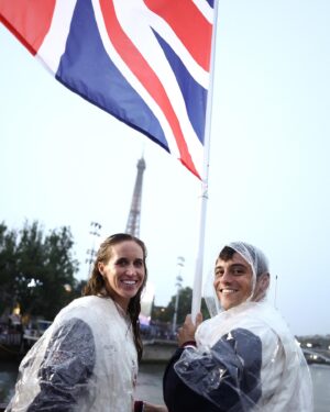 Tom Daley Instagram - 🇬🇧 TEAM GB FLAGBEARER 🇬🇧
•
•
Such an honour to be carrying the flag at the opening ceremony for Team GB with @helenglovergb ❤️🇬🇧 I made a little heart hand signal for my boys watching on TV! I am so excited to have them here to share this experience with me for my 5th games! Even if it was a little wet 💦 ☔️ #Olympics #Paris2024