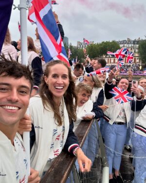 Tom Daley Instagram - 🇬🇧 TEAM GB FLAGBEARER 🇬🇧
•
•
Such an honour to be carrying the flag at the opening ceremony for Team GB with @helenglovergb ❤️🇬🇧 I made a little heart hand signal for my boys watching on TV! I am so excited to have them here to share this experience with me for my 5th games! Even if it was a little wet 💦 ☔️ #Olympics #Paris2024