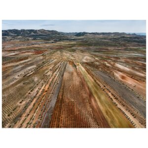 Tom Hegen Instagram - New Series release – The Spanish Farmland Series II 

In this aerial series, I explore the stunning landscape of agricultural fields in central Spain. Over centuries, Spanish farmers transformed the landscape into a patchwork of abstract art. They adapted to the rugged topography by carving tracks, fields and plantations into the terrain. 

Even though the soil is quite fertile, cultivating the fields is challenging due to increasingly low rainfall and extreme heat. For that reason, the fields are organized in terraces to prevent rainwater from flowing off. Some fields are still cultivated, while others have been abandoned due to excessive labour and low yields.

Seen from the air, the landscape resembles a subtle arrangement of blood cells, ordered into a patterned carpet covering the surface. 

I’m interested in finding the most abstract forms of human-altered landscapes—places where the transition from photography to painterly images is fluid. However, farmers on the ground are the actual designers of the images, supposedly with an economic rather than an artistic intention. I see myself as the observer, curating their work into artworks with a subtle eye.