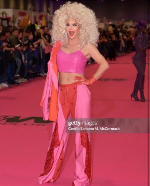 Trinity the Tuck Instagram - What an incredible weekend at @rupaulsdragcon UK! Thank you all who came to visit me at my booth! It was my pleasure to talk to each of you! Thank you to my team of Tuck Support who helped facilitate such a professional and easy work space! I’ll see you at the next one ! Hair by the incredible @baehmbaehmwigs suit embellished by @natalia_at_nite and the amazing blue jacket by @mr_riegillio . Jewels by @ampedaccessories . Photo credit by @stunnin.mag and @gettyimages