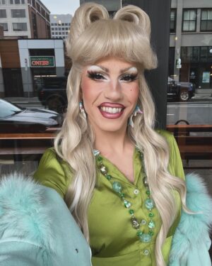 Vivian Vanderpuss Instagram - ❄️🍃 
Okay I love this colour combo. The wig used to have a kind of curly bumper bang moment but I brushed it out and made this mega “curtain bang”. Honestly it’s having a bit of an identity crisis but @queen.irmagerd said it was “Hedwig meets the Brady Bunch”. 
My earrings are vintage wooden dolphins that look like they’ve been up for days.🎉🐬 
#outfitsforacrispautumnday