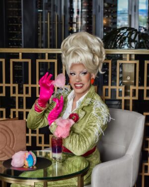 Vivian Vanderpuss Instagram - I’m so excited for Pride Week here in Victoria! This year you can find me on the @fairmontempress float. 

✨ Check out these fabulous pride cocktail and dessert specials at the Q Lounge. A portion of the proceeds from them is donated to @victoriapridesociety .

📸 photos by @teeamarshall 
Dress by @prusadesigns 
Hair by me. 
.
.
#vivianvanderpuss #fairmontempress #fairmonthotels #victoriapride