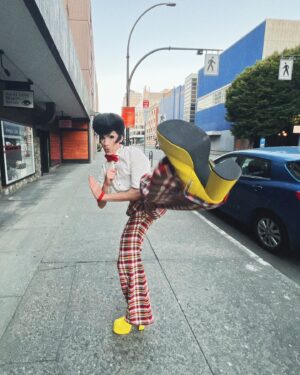 Vivian Vanderpuss Instagram - Do these pants make my legs look lithe? 
Some fab little shots from Wigstock during Pride week @theviciouspoodle with Woofie (@seanburgundy ) 
It was the third show of the day so we went heavy with the filter ha! 
✨
I made this wig a long time ago and it’s been sitting on my shelf waiting for the perfect character. I was a game show host, a biker, a little Freddie and a phantom in one eve. I wasn’t sure (with how big this hat was) how it would hold up doing 5 numbers real quick but it was perfectly fine! God bless hairspray and a good tease! 
✨
The hair is inspired by Wooden Sword Ryu from Shaman King! 
.
.
.
.
#drag #dragking #dragkingmakeup #vivianvanderpuss #wig #dragwig