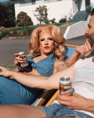 Vivian Vanderpuss Instagram - Crack open a cold one for dad. ☀️ 
.
These are the first of a series of pictures taken by Socrates D. styled by me. I wanted to capture those fab vintage vintage vibes! Thanks for the lawn chairs @ejmears !
💇🏼‍♀️hair by me
👙Top by me 
👖 vintage Viceroy from @cheersvintagecollective 
#vivianvanderpuss #canadasdragrace #70s #vintage #vibes #fathersday #denim #summer #solstice