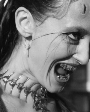 Alina Pash Instagram - If you’re bold enough to peep my custom silver grillz from the one and only @AlligatorJesus, you’ll spot a secret word — and trust me, it’s got something to do with you too 💀❤️
_________
Photo @daniel.rubinshtein 
Photo @tony.muhin
